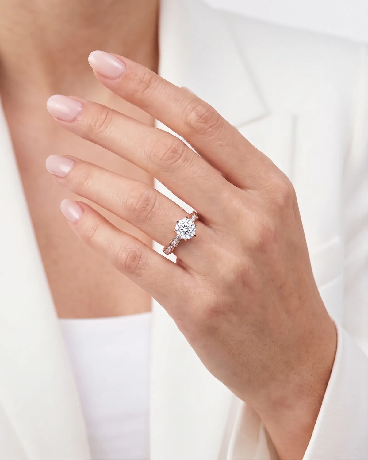 Amora Échelle d’Amour diamond engagement ring worn on hand in 18K rose gold | SARATTI