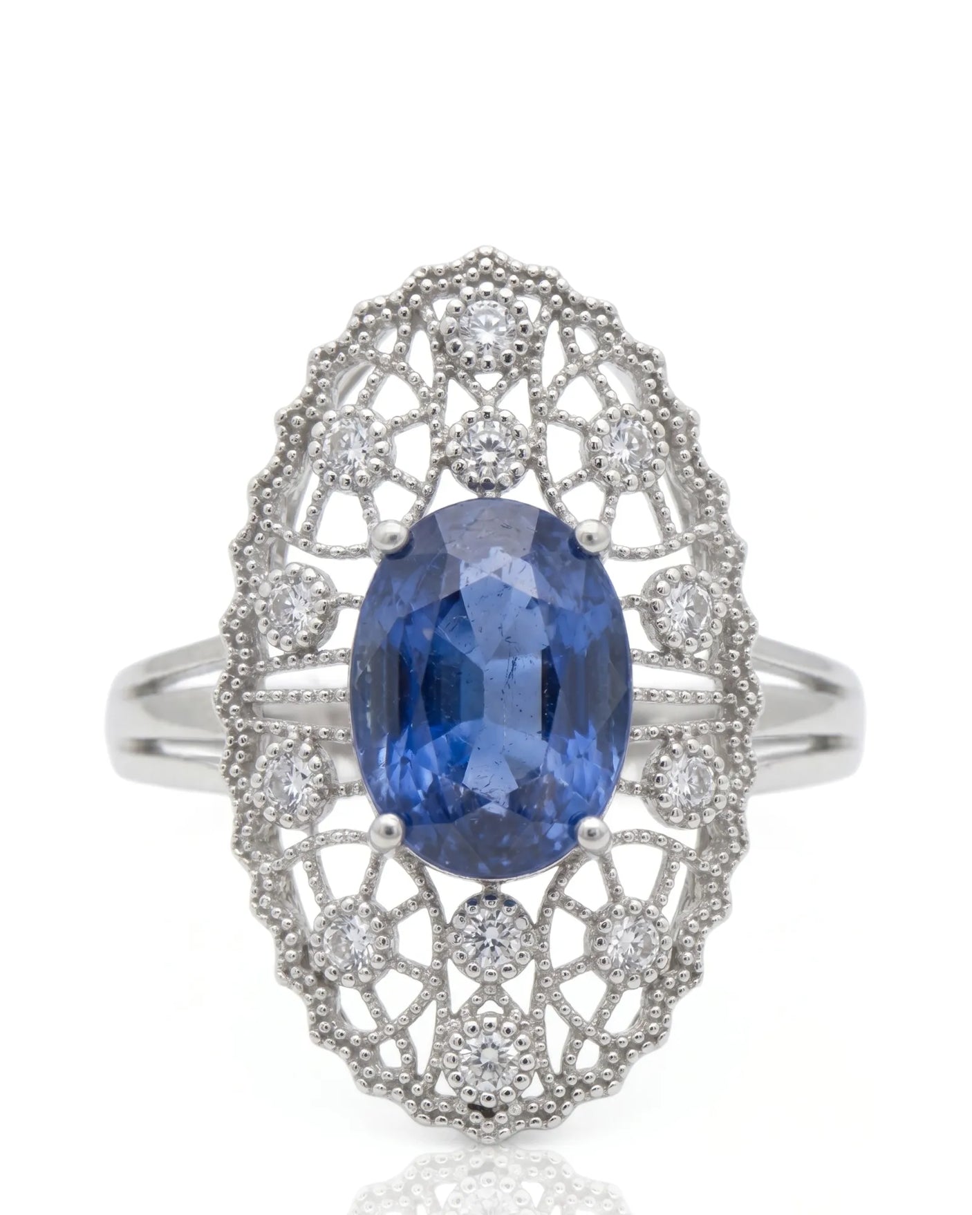 Antique-inspired sapphire ring with openwork diamond halo in polished platinum | SARATTI