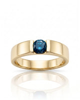 Architectural blue diamond ring featuring a sculpted wide band and clean 18K yellow gold surfaces | SARATTI