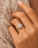 Architectural cushion moissanite ring with structured halo and tapered baguette shoulders in yellow gold | SARATTI