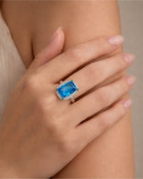 Architectural cushion topaz ring with geometric diamond frame and open gallery in 18K white gold | SARATTI