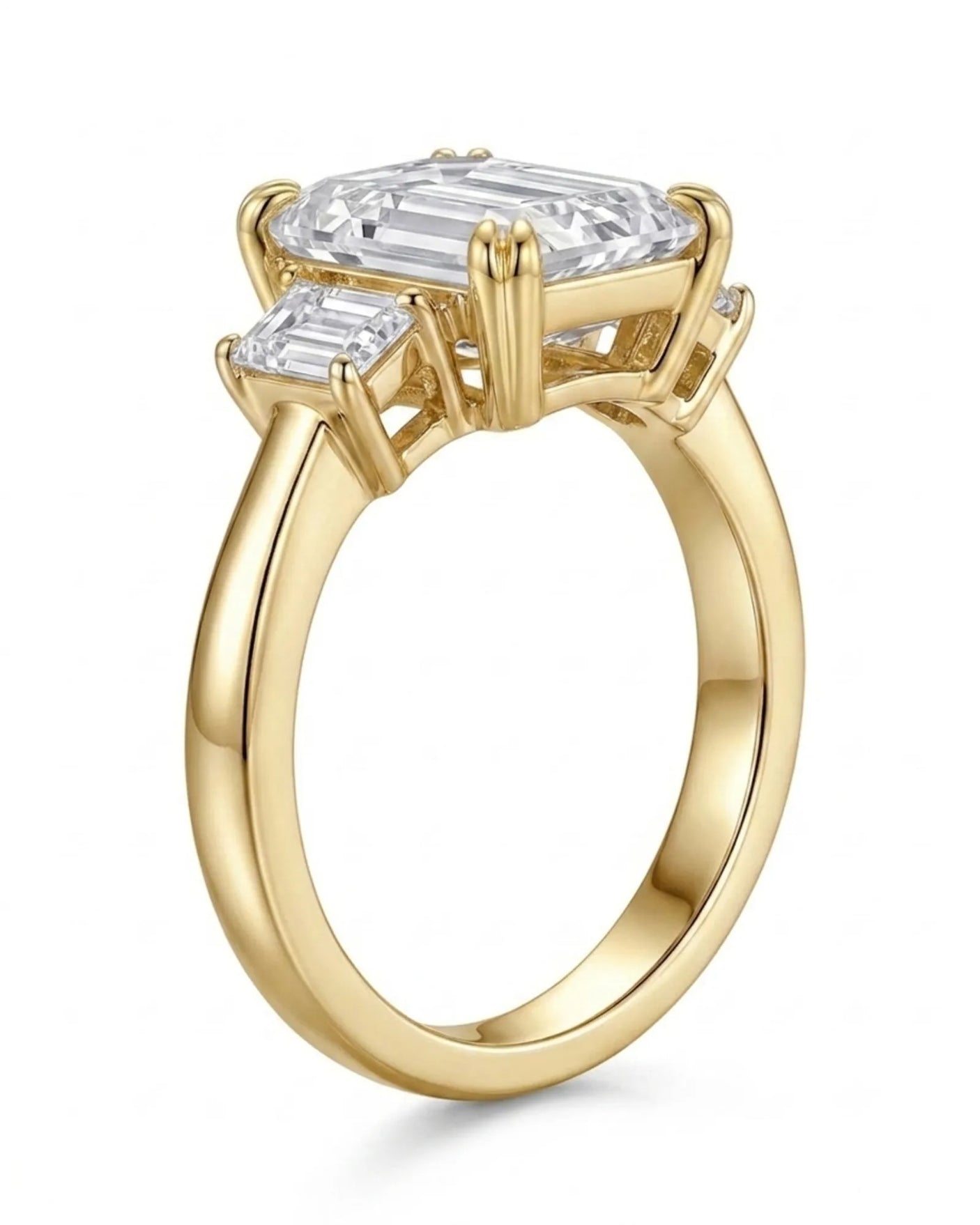 Architectural three stone moissanite engagement ring with clean yellow gold setting | SARATTI