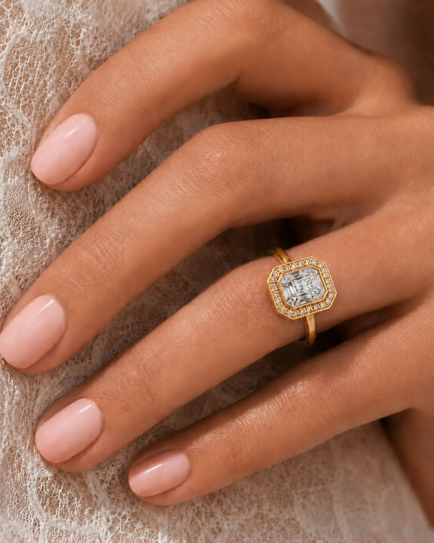 Architectural yellow gold radiant cut ring with brilliant halo-set moissanite | SARATTI
