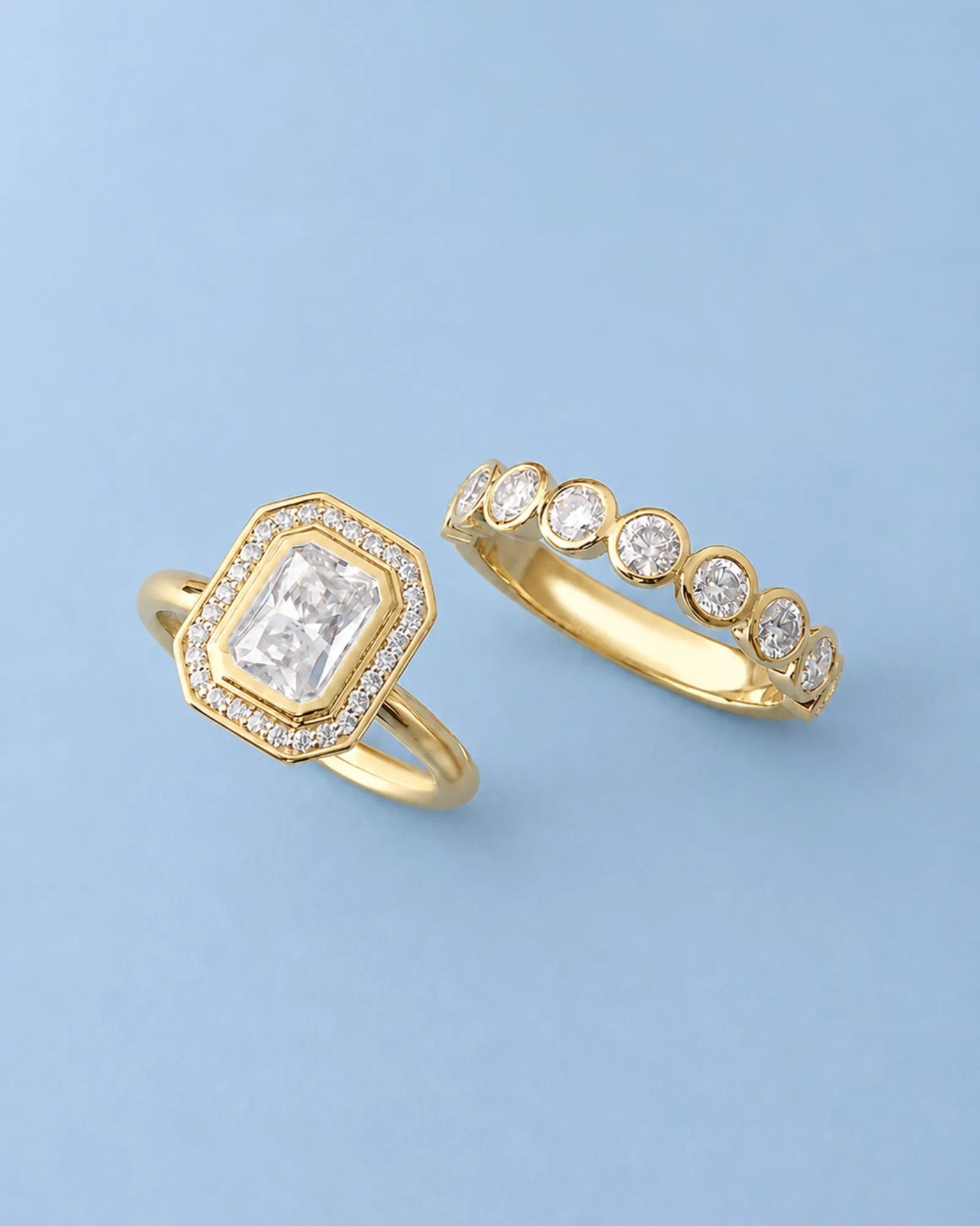 Art Deco moissanite engagement ring with stepped geometric halo and round accents in 18K yellow gold | SARATTI