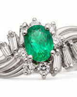 Oval cut natural emerald ring with round and baguette diamonds in platinum | SARATTI