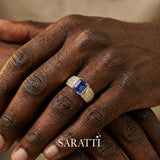 Mens ring with tanzanite and diamonds worn on hand in 18K yellow gold | SARATTI