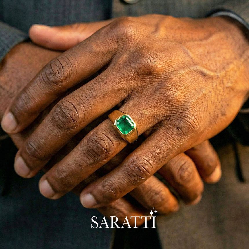 Mens emerald wedding ring emerald cut center stone detail in 18K yellow gold | SARATTI