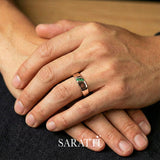 Mens emerald ring worn on hand three stone design in 18K rose gold | SARATTI