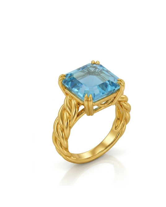 Asscher cut aquamarine prong set ring with sculptural rope band in 18K yellow gold | SARATTI