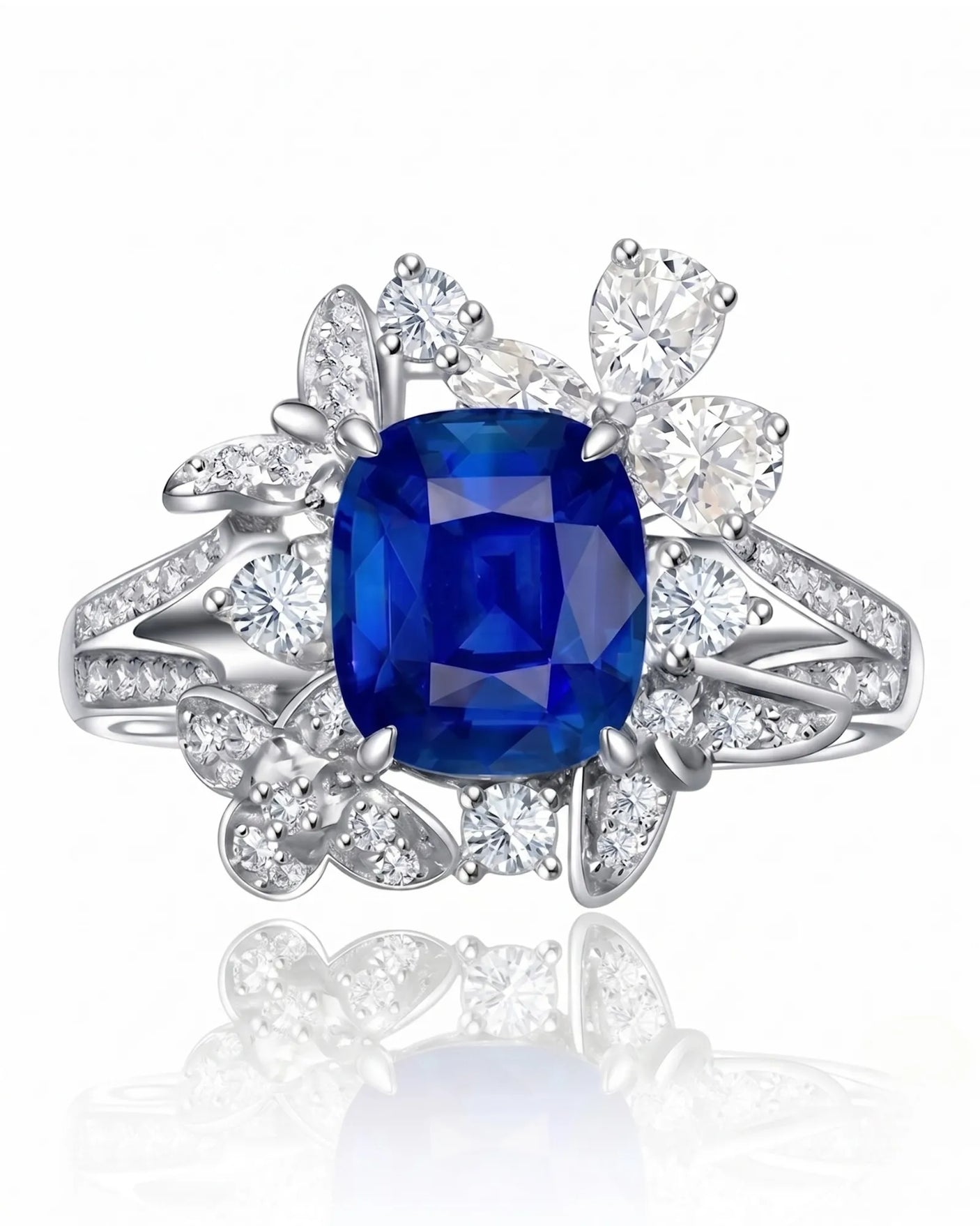 Asymmetrical sapphire ring with pear, round, and marquise diamonds in platinum | SARATTI