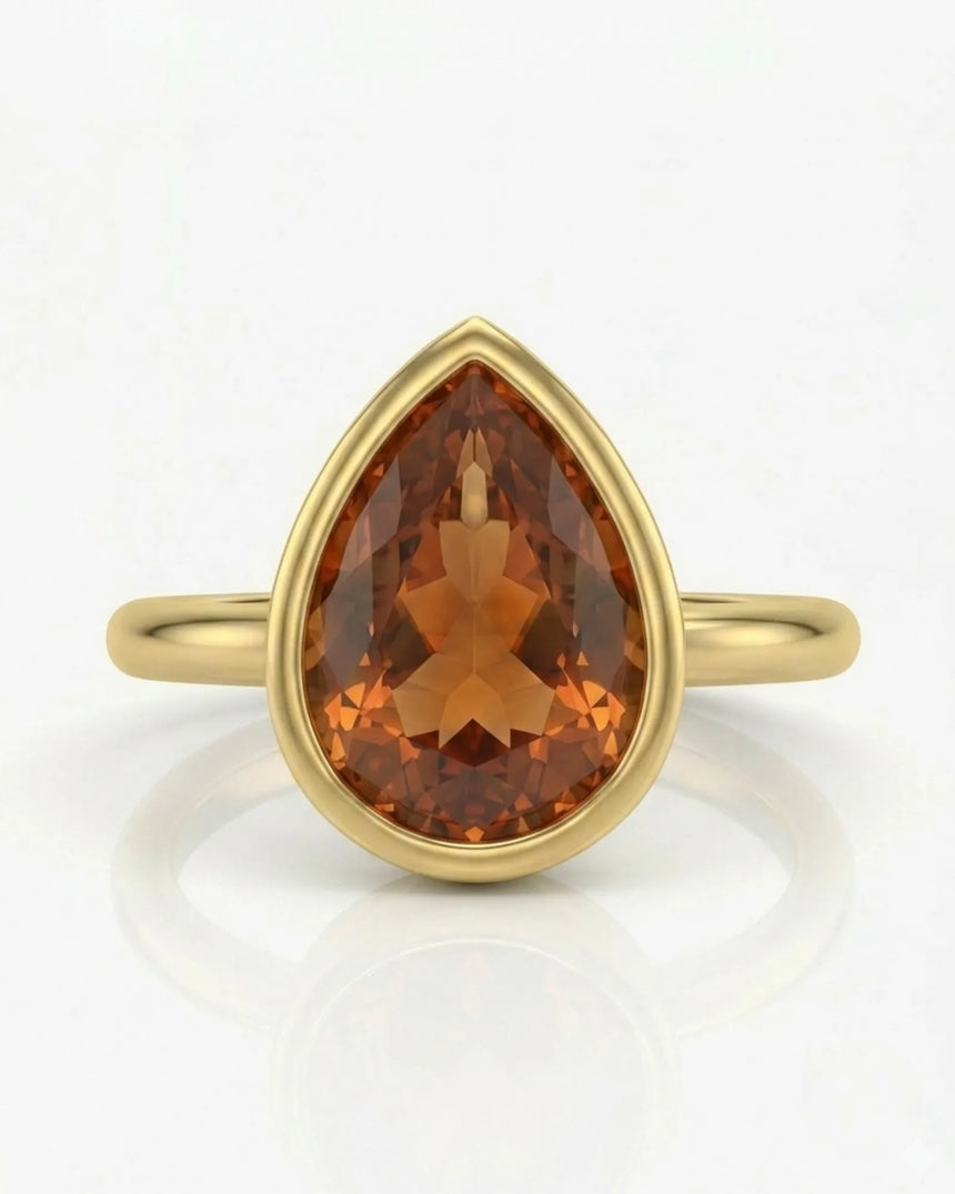 Aurex pear Topaz setting with a polished 18K yellow gold band | SARATTI