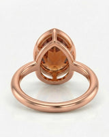 Aurex rose gold setting for a selected pear-shaped Imperial Topaz | SARATTI