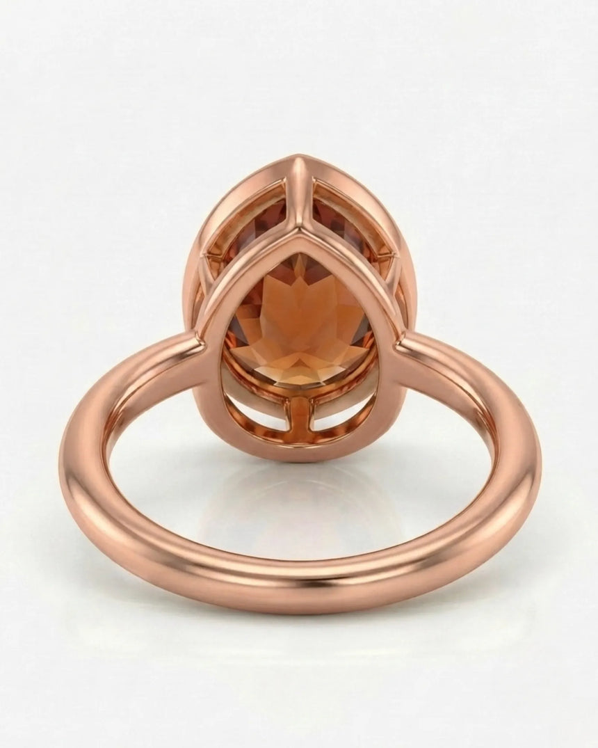 Aurex rose gold setting for a selected pear-shaped Imperial Topaz | SARATTI
