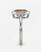 Aurex white gold setting with a smooth pear-shaped Topaz bezel | SARATTI