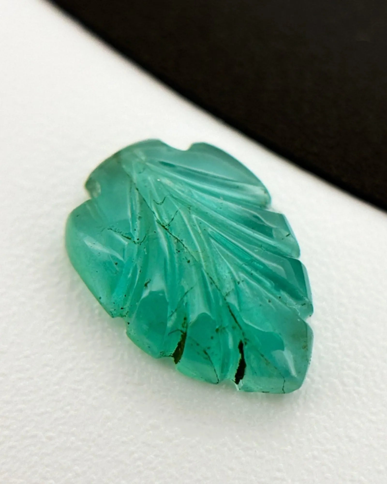 Back view of 1.18ct Natural Emerald carved leaf gemstone | SARATTI