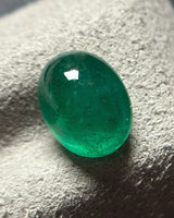 Back view of 2.5ct Natural Emerald oval cabochon gemstone | SARATTI