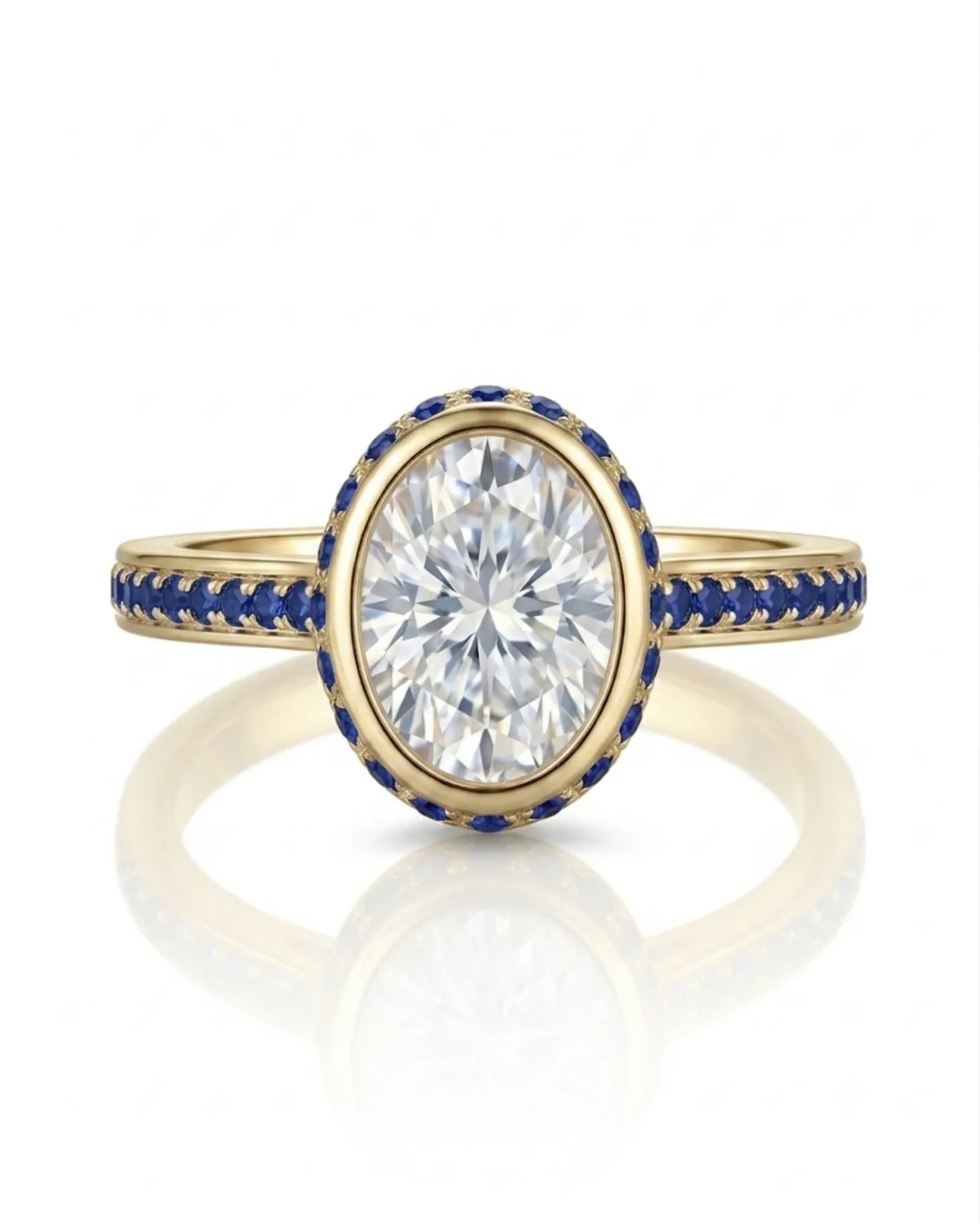 Bezel-set oval natural diamond ring with sapphire halo and refined band in warm 18K yellow gold | SARATTI