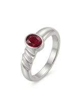 Bezel set oval natural ruby solitaire ring in platinum with sculpted wave band | SARATTI