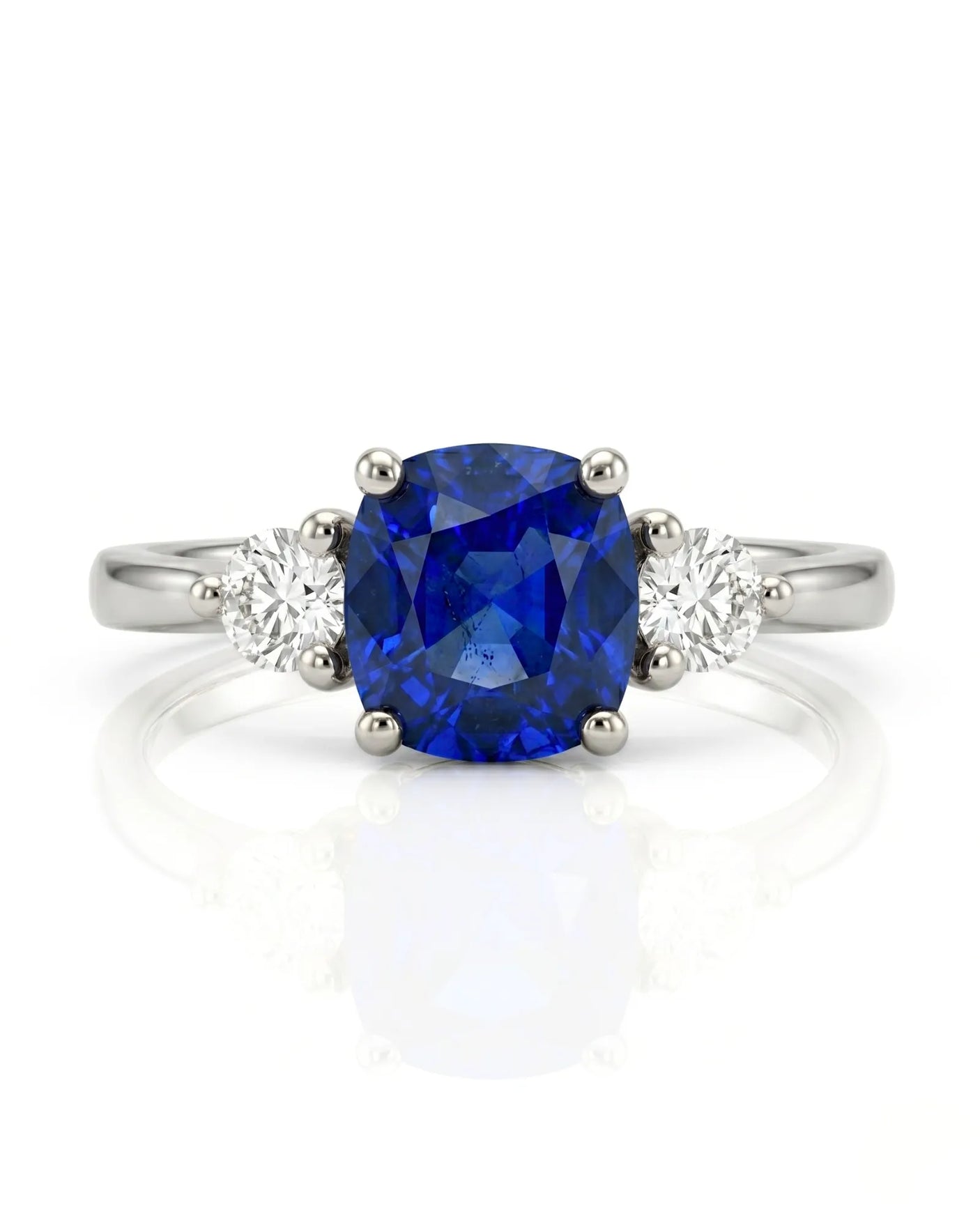 Blue cushion sapphire ring with natural diamond side stones in enduring platinum | SARATTI