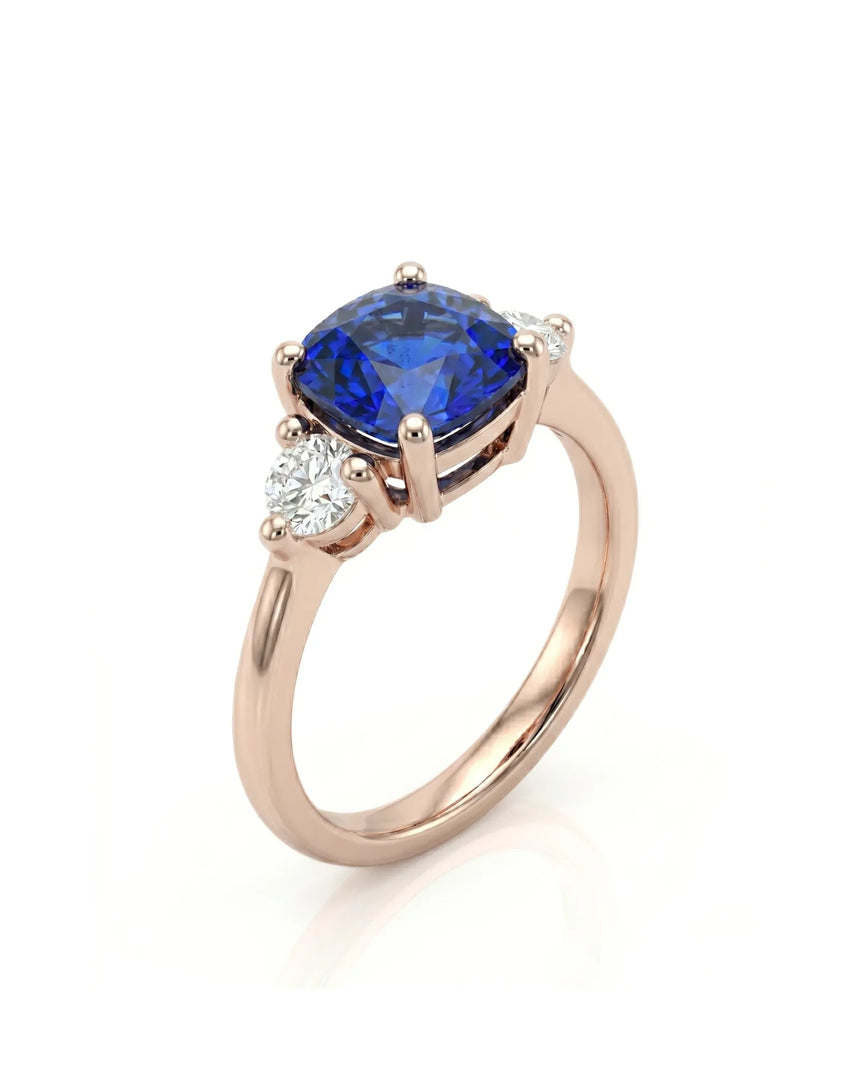 Blue cushion sapphire ring with natural diamond side stones in rose gold | SARATTI