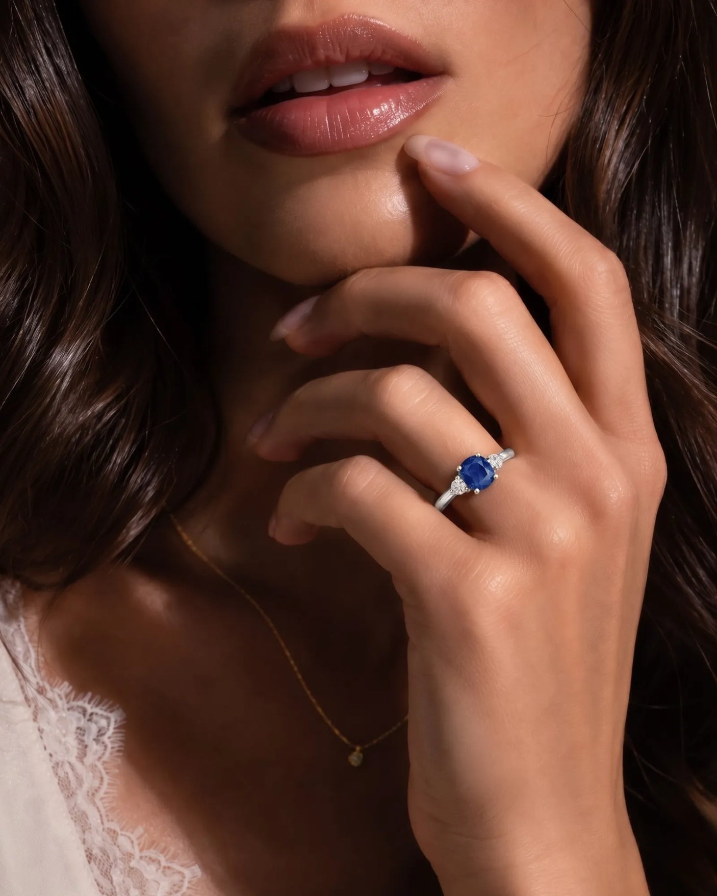 Blue cushion sapphire ring with natural diamond side stones in white gold | SARATTI