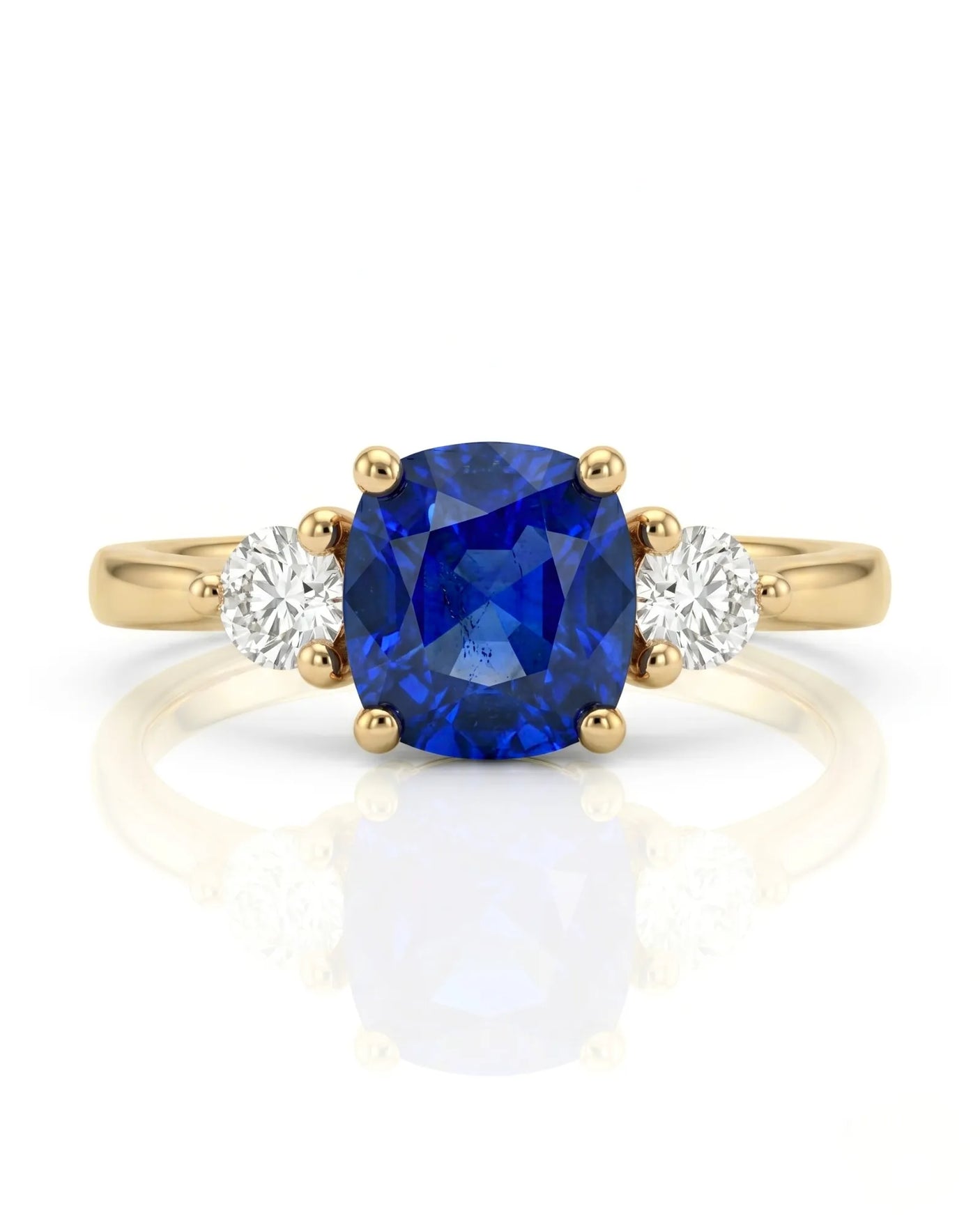 Blue cushion sapphire ring with natural diamond side stones in yellow gold | SARATTI