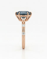 Blue moissanite ring with sculptural prong setting and romantic rose gold band | SARATTI