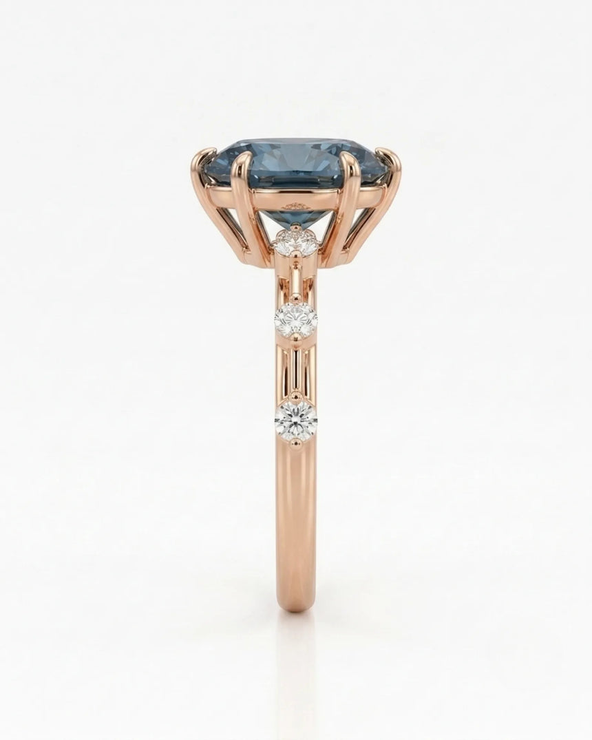 Blue moissanite ring with sculptural prong setting and romantic rose gold band | SARATTI