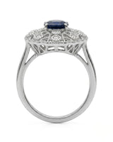 Blue oval sapphire ring with round diamond details and milgrain platinum setting | SARATTI