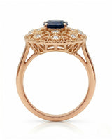 Blue oval sapphire ring with round diamond details and milgrain rose gold setting | SARATTI