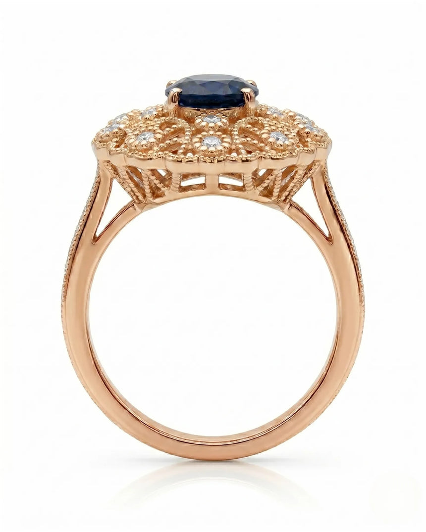 Blue oval sapphire ring with round diamond details and milgrain rose gold setting | SARATTI