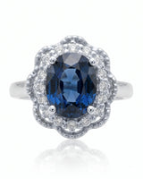 Blue oval sapphire ring with round natural diamonds in 18K white gold - SARATTI