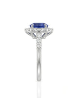 Blue sapphire and diamond engagement ring with halo in 18K white gold | SARATTI