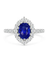 Blue sapphire and diamond engagement ring with halo in platinum | SARATTI