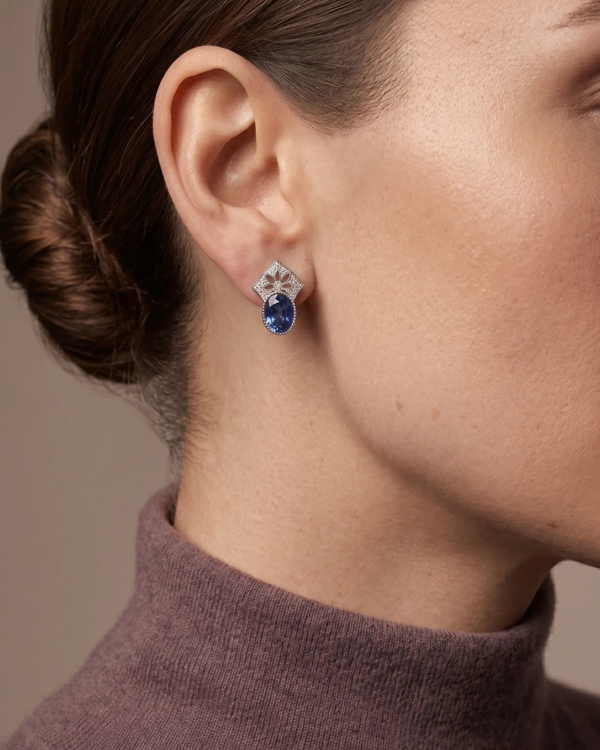 Blue sapphire earrings featuring an open floral diamond motif crafted in 18K white gold | SARATTI