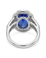 Blue sapphire engagement ring with diamond halo and yellow shoulder stones in platinum | SARATTI