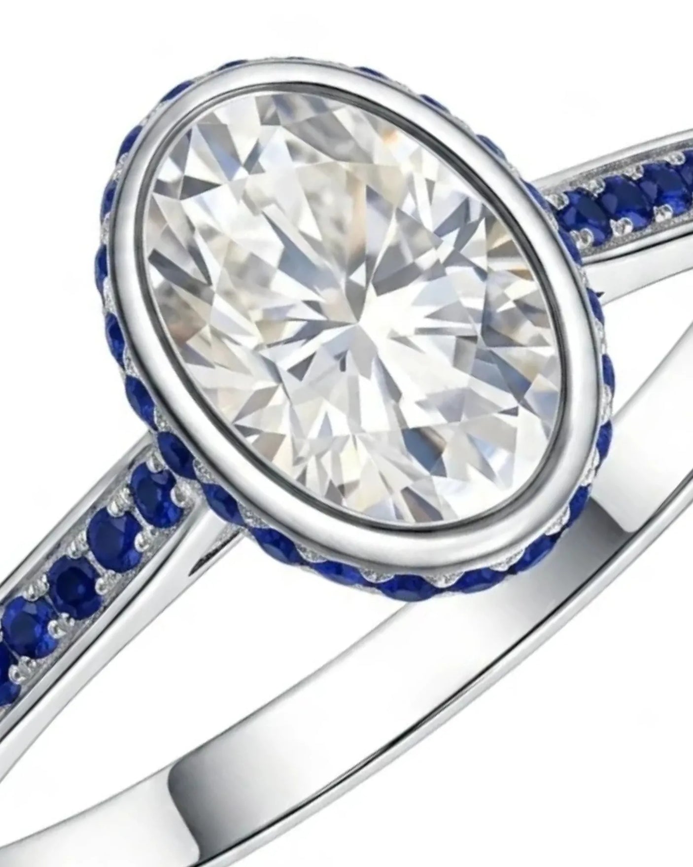 Blue sapphire halo engagement ring with bezel-set oval natural diamond in 18K white gold | SARATTI