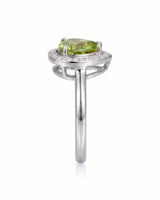 Bright green tourmaline ring with delicate diamond halo and elegant Platinum setting | SARATTI