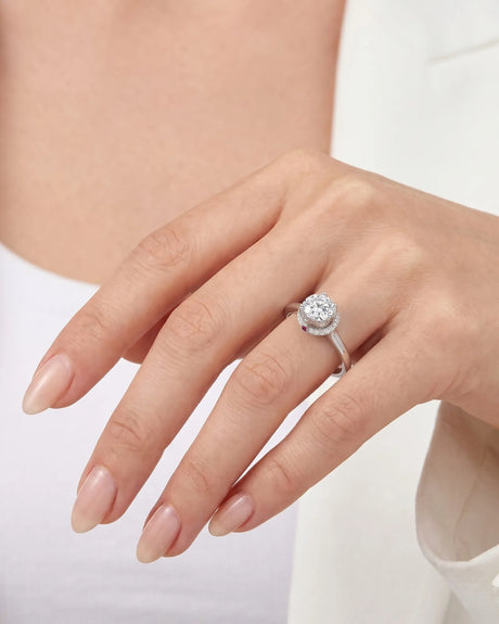 Cesca GIA-certified natural round diamond engagement ring worn on hand in 18K white gold | SARATTI
