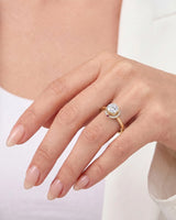 Cesca natural round diamond lotus illusion engagement ring model hand view in 18K yellow gold | SARATTI