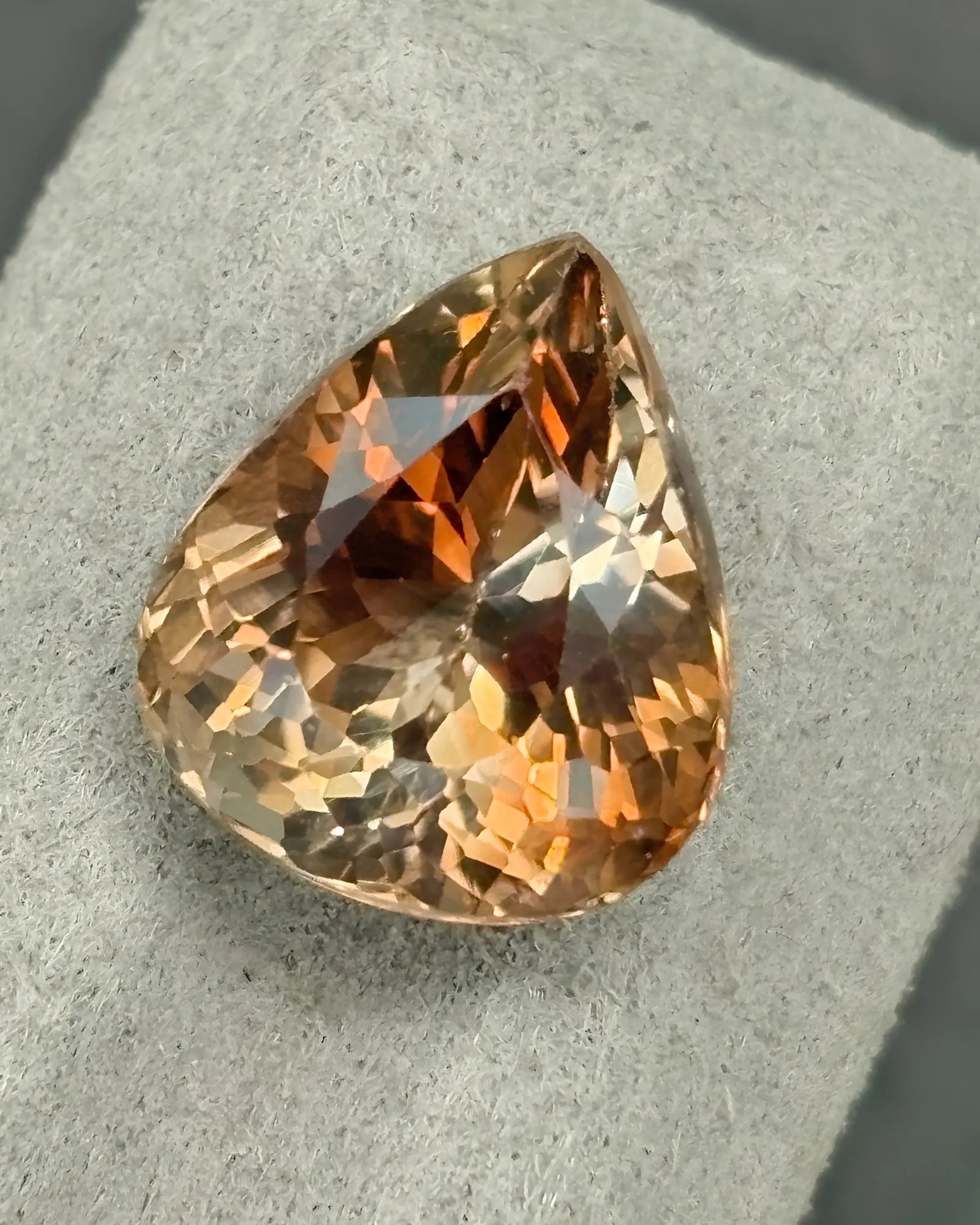 Champagne pear-cut Natural Imperial Topaz alternate angle | SARATTI