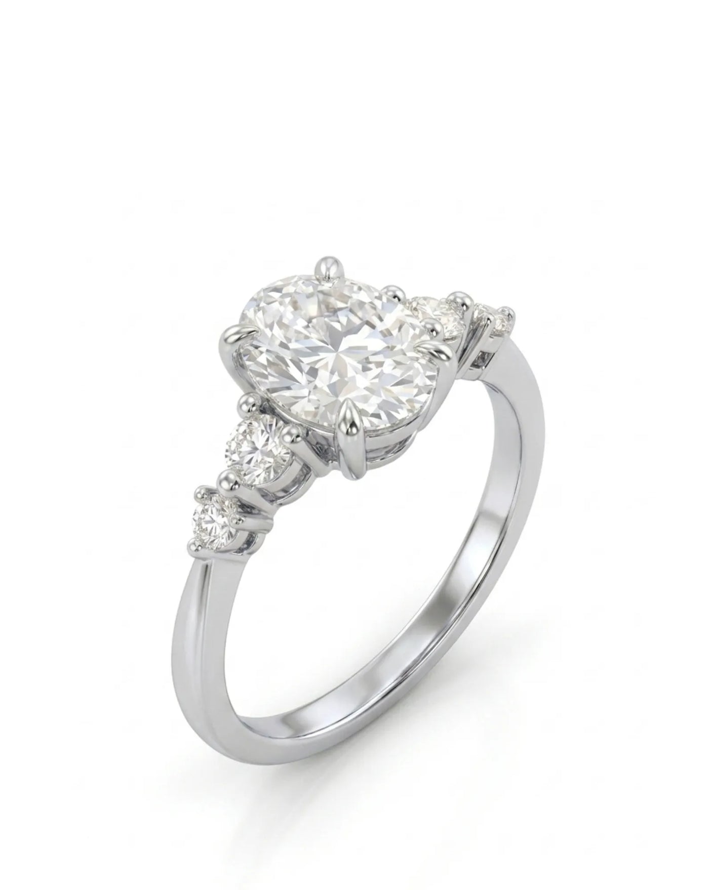 Chloe oval diamond engagement ring with graduated round side diamonds in polished 18K white gold | SARATTI