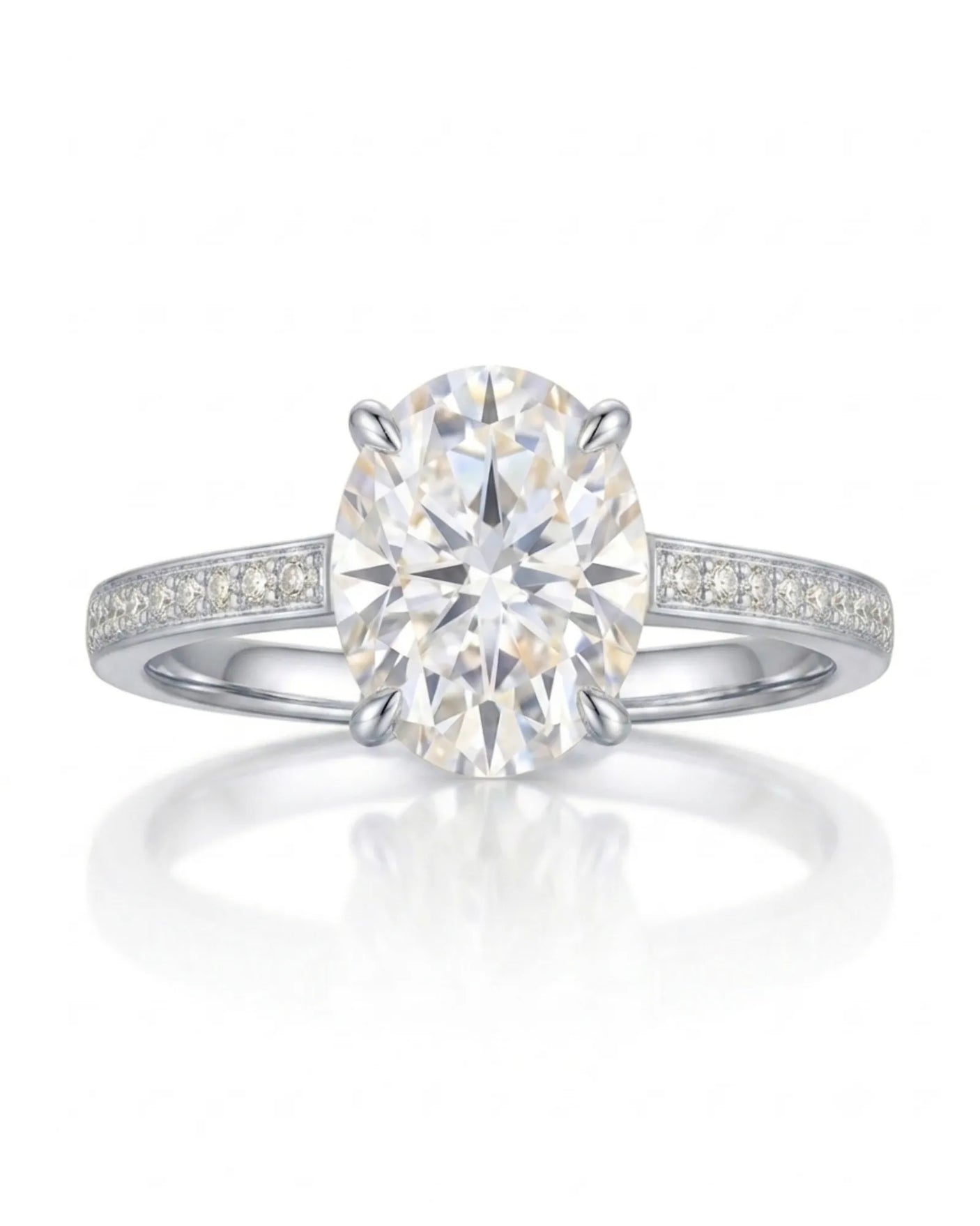 Classic oval moissanite ring with four prong setting and pavé band in platinum | SARATTI