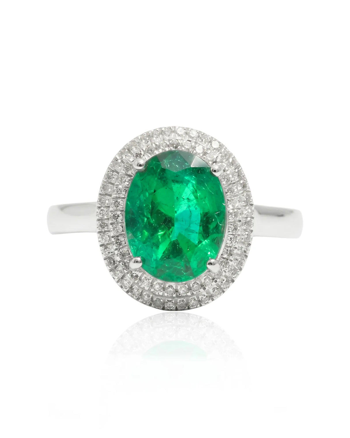 Classic oval natural emerald ring with round diamond halo in platinum | SARATTI
