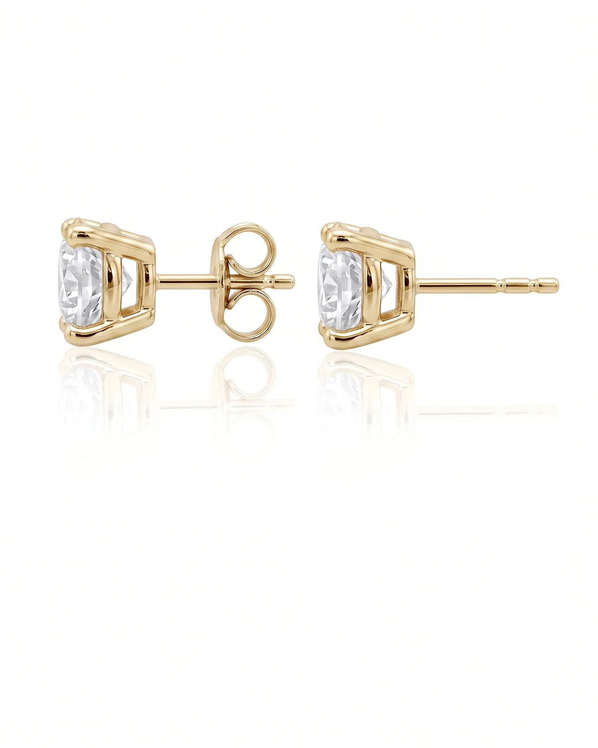 3.00 ct. tw. lab-grown round diamond four-prong studs in 14K yellow gold, prong detail | SARATTI