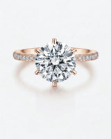 Classic round moissanite ring with pavé shoulders and rose gold band | SARATTI