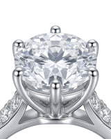 Classic round moissanite ring with polished band and pavé accents in platinum | SARATTI