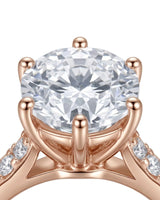 Classic round moissanite ring with polished band and pavé accents in rose gold | SARATTI