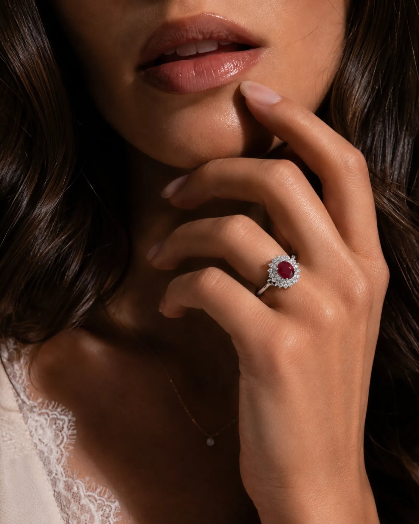 Classic ruby ring with round diamond halo and floral design in white gold | SARATTI