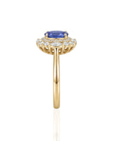 Classic sapphire halo ring with refined diamond frame in 18K yellow gold | SARATTI